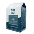 A 12 oz bag of Zuna Coffee Pearl Blend medium roast coffee, featuring a white and dark teal packaging design with a geometric leaf logo.