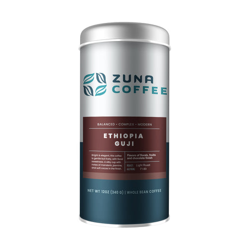 A tall cylindrical canister of Zuna Coffee Ethiopia Guji whole bean coffee on a plain white background. The canister has a metallic silver upper section, a dark reddish-brown middle band with white text, and a dark teal lower section.