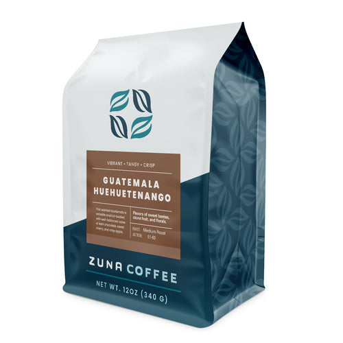 A 12 oz bag of Zuna Coffee Guatemala Huuetenango medium roast coffee, featuring a white and dark teal packaging design with a brown label.